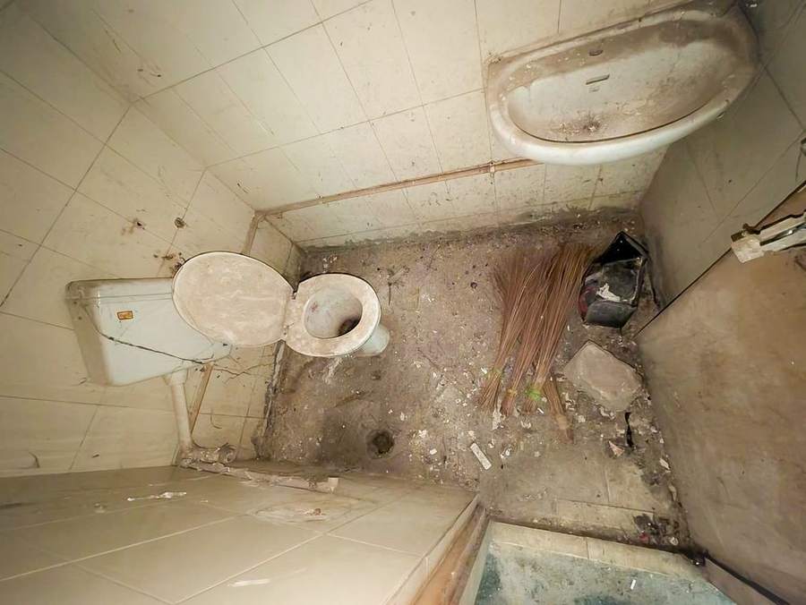 Deteriorated hospital washroom before renovation (1)